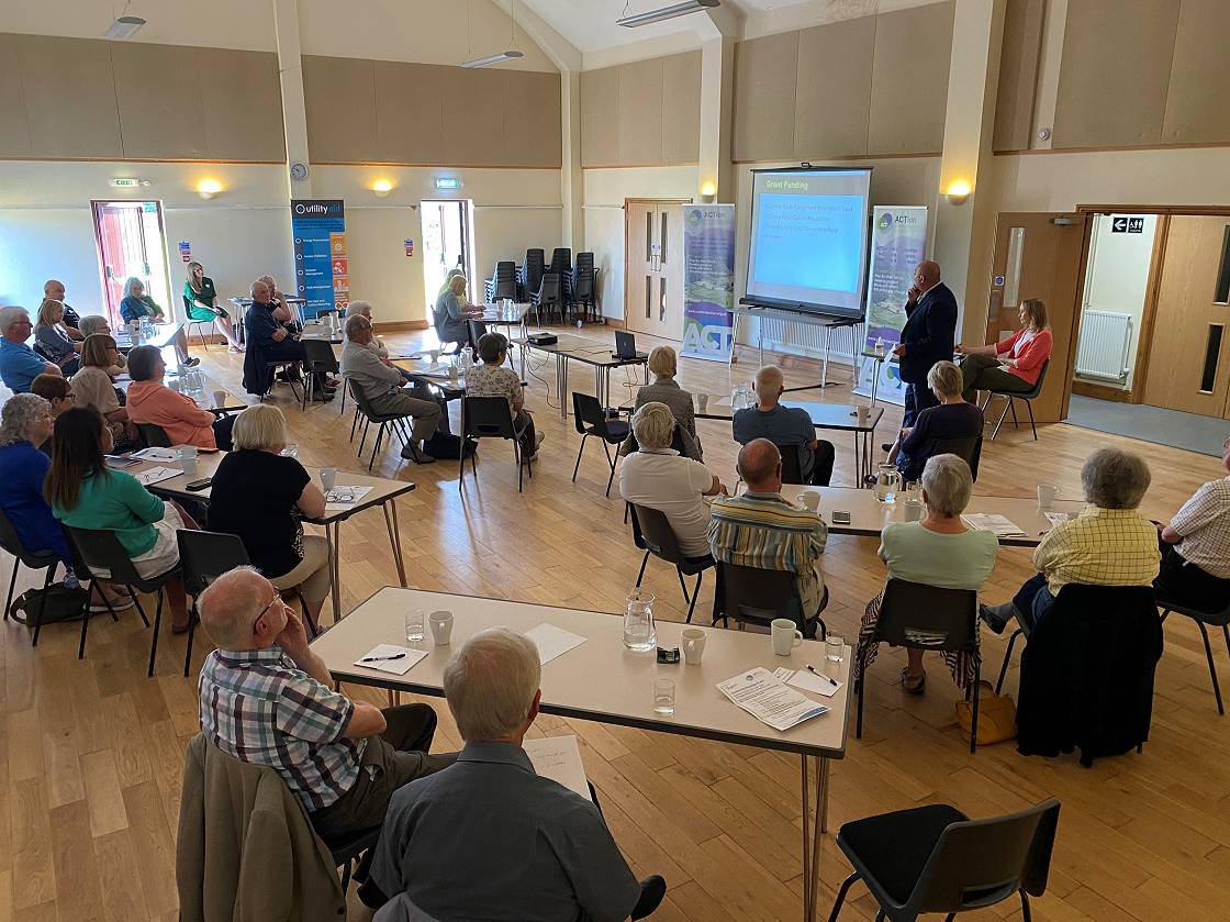 Inside Newbiggin Village Hall, John Atkinson speaking about Dalston Victory Hall refurbishment and Hallmark