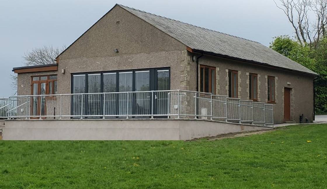 Exterior photo of the rear of the village hall.